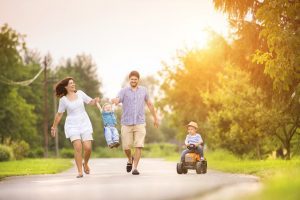 Family walking together down the street after receiving Life Insurance from RG Insurance Agency in Pharr, TX