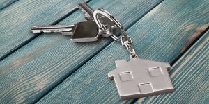 Keys on a house-shaped keychain