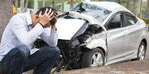 Driver with head in hands after getting into an auto accident