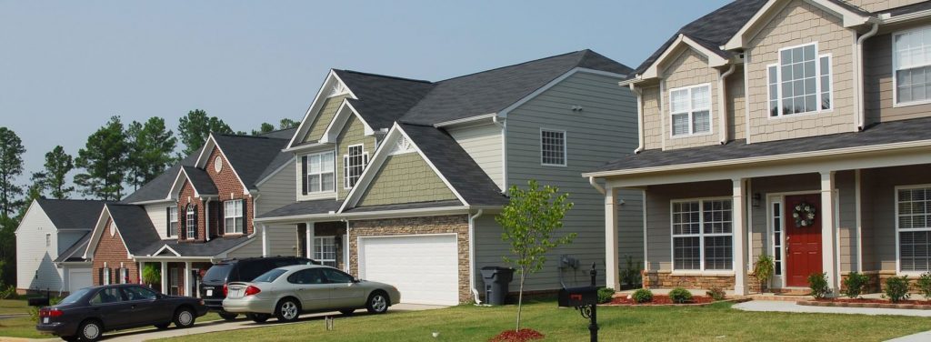 Houses in a residential neighborhood protected by home insurance