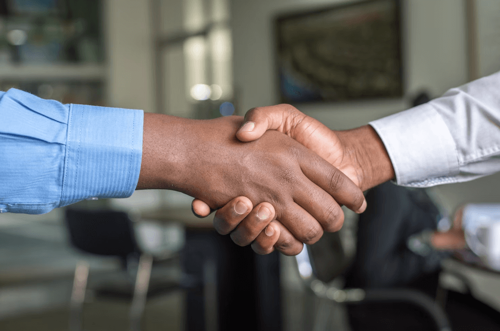 Two men shaking hands after making a business deal at a dependent insurance agency in Pharr, Texas – RG Insurance Agency